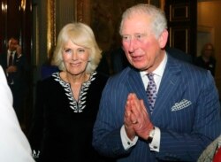 FILE - Britain's Prince Charles and Camilla, Duchess of Cornwall attend the annual Commonwealth day reception at Marlborough House, the home of the Commonwealth Secretariat, in London, March 9, 2020.