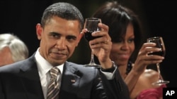 U.S. President Barack Obama and first lady Michelle Obama toast at the official dinner offered by Chile's President Sebastian Pinera at the government palace La Moneda in Santiago, Chile.