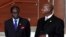 Zimbabwe President Robert Mugabe (L) stands next to his Ugandan counterpart Yoweri Museveni while marking the 50th anniversary of the establishment of the Organization of African Union (OAU) in Addis Ababa May 25, 2013.