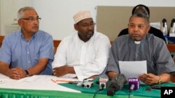 Supreme Council of Kenya Muslims secretary general Adan Wachu (C) is pictured in this August 30, 2012, file photo with Kishore Shah, of the Hindu Council of Kenya (L), and Fr. Wilybard Lagho, of the Coast Interfaith Council of Clerics, in Mombasa.