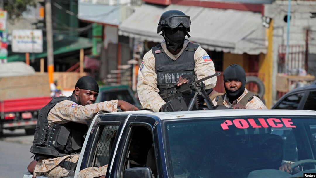 FILE - Haitian national police officers patrol a street of Port-au-Prince, Haiti, Nov. 16, 2016. 