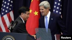 U.S. Secretary of State John Kerry shakes hands with Chinese Vice Premier Wang Yang after the U.S.-China Strategic and Economic Dialogue Joint Opening Session at the State Department in Washington July 10, 2013.