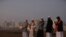 FILE - Muslim clerics scan the skies over Cape Town, South Africa, for a new moon marking the end of Ramadan, May 23, 2020. Some South Africans are chafing at the country’s refusal to recognize religious marriages. 