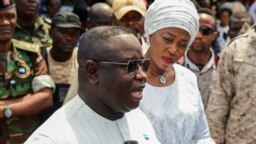 FILE - Sierra Leone's President and ruling party candidate Julius Maada Bio speaks to journalists after casting his vote for national elections at a polling station in Freetown, Sierra Leone, June 24, 2023.