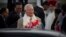 Malaysian Prime Minister Najib Razak holds a bouquet of flowers presented to him upon arrival in New Delhi, India, March 31, 2017.