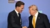 NATO Secretary General Mark Rutte and US President Donald Trump shake hands as they join NATO leaders for a family photo during the NATO Summit at Bestepe Presidential Compound in Ankara, Turkey, July 8, 2026. 
