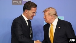 NATO Secretary General Mark Rutte and US President Donald Trump shake hands as they join NATO leaders for a family photo during the NATO Summit at Bestepe Presidential Compound in Ankara, Turkey, July 8, 2026. 