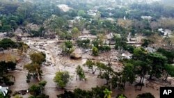 This aerial photo provided by the Santa Barbara County Fire Department shows mudflow and damage to homes in Montecito, Calif., Jan. 10, 2018.