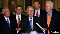 Senate Majority Leader Mitch McConnell, center, holds a news conference with fellow Republican leaders on possible Supreme Court nominations after their party caucus luncheon on Capitol Hill in Washington, Feb. 23, 2016. 