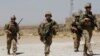 FILE - U.S. troops patrol at an Afghan National Army (ANA) Base in Logar province, Afghanistan, Aug. 7, 2018. 