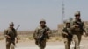 FILE - U.S. troops patrol at an Afghan National Army base in Logar province, Afghanistan, Aug. 7, 2018. 