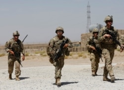 FILE - U.S. troops patrol at an Afghan National Army (ANA) Base in Logar province, Afghanistan, August 7, 2018.