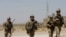 FILE - U.S. troops patrol at an Afghan National Army (ANA) Base in Logar province, Afghanistan, Aug. 7, 2018. 