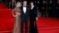 (L to R) Lea Seydoux, Daniel Craig and Monica Bellucci pose for photographers as they attend the world premiere of the new James Bond 007 film "Spectre" at the Royal Albert Hall in London, Britain, October 26, 2015.