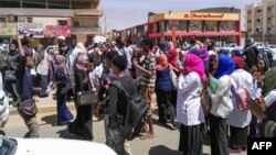 Protesters shout "freedom, peace, justice" during an anti-government demonstration in Khartoum, Sudan, March 18, 2019. 