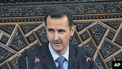 Syrian President Bashar al-Assad addresses the nation during a speech at the Parliament in Damascus, Syria, March 30, 2011