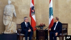 Lebanese President Michel Aoun, right, meets with his Austrian counterpart Alexander Van Der Bellen, at the Presidential Palace in Baabda, east of Beirut, Lebanon, Tuesday, Dec. 11, 2018.