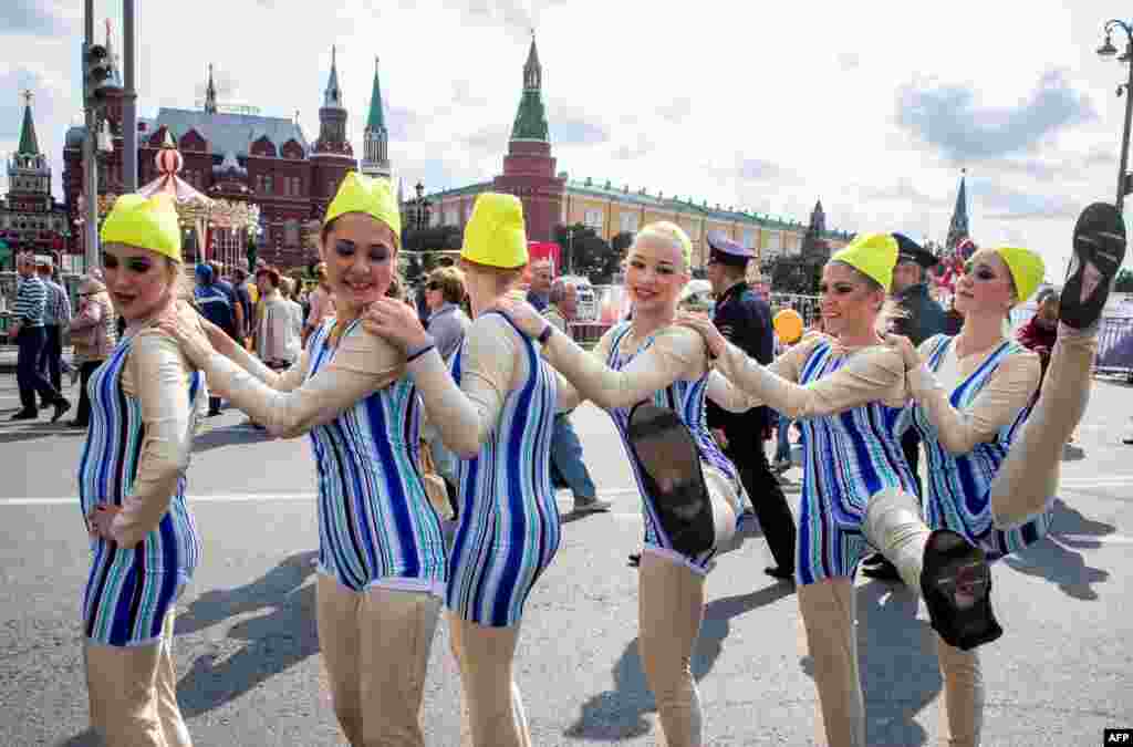 Dancers perform during celebrations of the 870th anniversary of the city in downtown Moscow, Russia, Sept. 10, 2017.