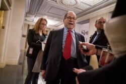 House Judiciary Committee Chairman Jerrold Nadler, D-N.Y., speaks with reporters after a closed-door session with his Democratic members to prepare for a public hearing Wednesday with legal experts.
