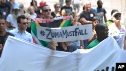 Protesters march near Parliament in Cape Town, South Africa, Feb. 11, 2016, calling for President Jacob Zuma to step down from power. Parliament opens later with Zuma delivering his state of the nation address to parliament. 