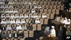 Sudanese President Omar al-Bashir, third right, talks at the National Assembly in Khartoum, Sudan, July 12, 2011