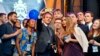 French president Emmanuel Macron takes a selfie with participants of the Charlemagne Youth Prize on the podium of a European Feast in Aachen, Germany, May 9, 2018.