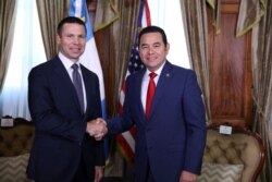 U.S. Department of Homeland Security acting Secretary Kevin McAleenan and Guatemalan President Jimmy Morales shake hands before a bilateral meeting in Guatemala City, Guatemala Aug. 1, 2019.