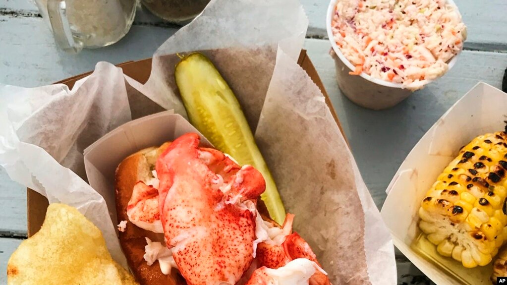 This image released by Goldbelly shows a lobster roll from McLoons Lobster Shack in Maine. (Goldbelly via AP)