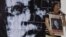 Mother of missing student activist Karen, speaks in front of a photo mosaic of Philippine President Benigno Aquino III during a rally to commemorate International Day of the Disappeared in Manila, Philippines, August 30, 2012.