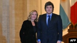 Italian Prime Minister Giorgia Meloni welcomes Argentinian President Javier Milei at Palazzo Chigi prior to their meeting in Rome on Dec. 13, 2024.