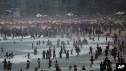 People enjoy the Ipanema beach amid the new coronavirus pandemic in Rio de Janeiro, Brazil, Sept.6, 2020.