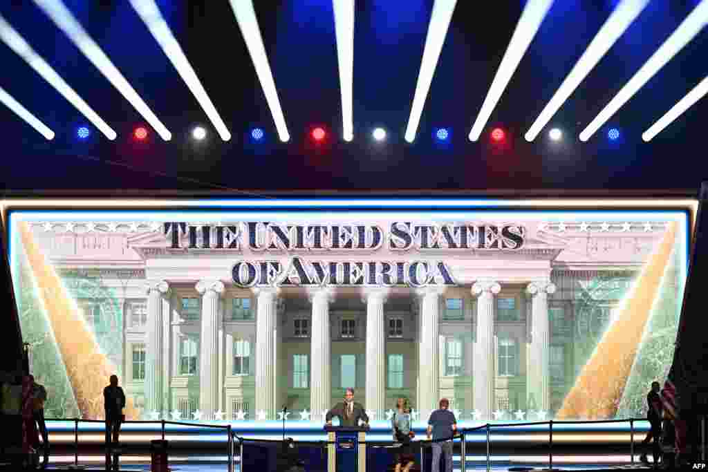 US Treasury Secretary Scott Bessent (C) stands on the stage during preparations ahead of the Republican National Committee (RNC) Midterm Convention at the American Airlines Center in Dallas, Texas on September 8, 2026.