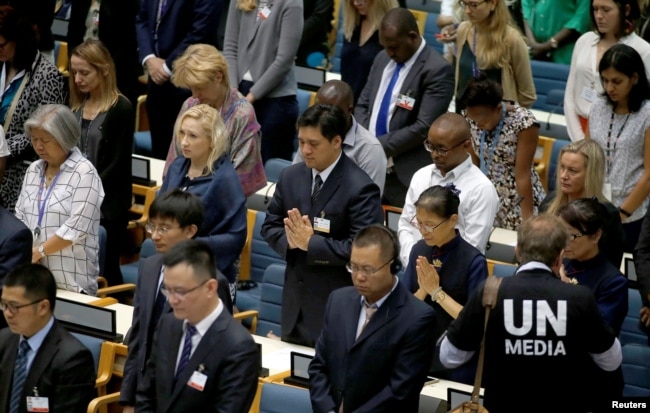 Delegates at the United Nations Environment Programme (UNEP) world environmental forum observe a minute's silence in memory of the victims of Ethiopian Airlines Flight ET 302 plane crash, at the UN complex within Gigiri in Nairobi, Kenya, March 11, 2019.