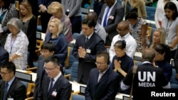 Delegates at the United Nations Environment Programme (UNEP) world environmental forum observe a minute's silence in memory of the victims of Ethiopian Airlines Flight ET 302 plane crash, at the UN complex within Gigiri in Nairobi, Kenya, March 11, 2019. 