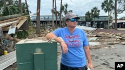 Brooke Hiers stands in front of where her home used to sit in Horseshoe Beach, Florida, Sept. 30, 2024, in the aftermath of Hurricane Helene.