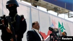 FILE - Saleh al-Sammad, political leader of Yemen's Houthis, center, addresses supporters during a rally in Sana'a, Yemen, Nov. 13, 2017. Sammad was reportedly killed last week in a Saudi-led airstrike.