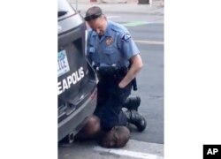 FILE - In this May 25, 2020, file frame from video provided by Darnella Frazier, then-Minneapolis Police Officer Derek Chauvin kneels on the neck of George Floyd, a handcuffed man who was pleading that he could not breathe.