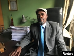 FILE - Ethiopian lawyer Wondimu Ebsa, who represented political prisoners detained during unrest in the country over the past three years, poses for a photograph during a Reuters interview in his office in Addis Ababa, Ethiopia, July 25, 2018.