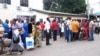 Supporters of Ghana's Ruling National Democratic Congress gather outside the ruling party headquarters in Accra following the death of Ghana's president,July 24, 2012. 