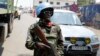 FILE - A U.N. peacekeeper patrols near the border crossing point between Rwanda and the Democratic Republic of Congo in Goma.