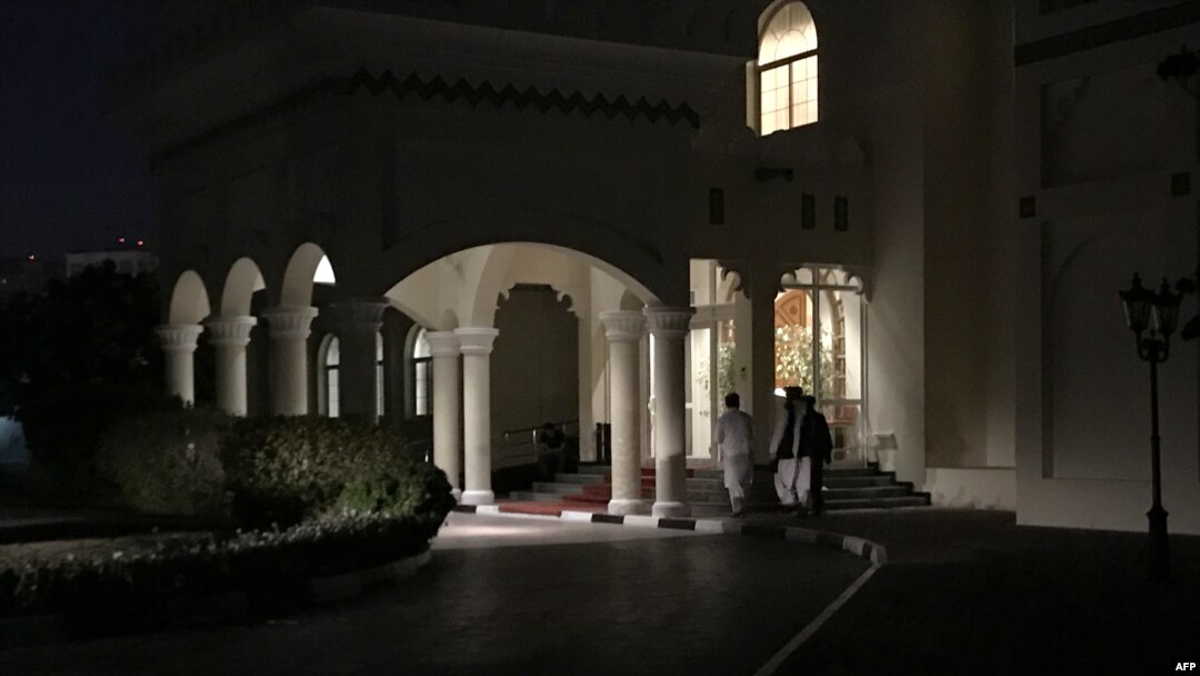 FILE - Members of Taliban negotiating team enter the venue housing the talks between U.S. and Taliban negotiators in the Qatari capital Doha, Aug. 29, 2019. 