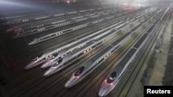 CRH380 (China Railway High-speed) Harmony bullet trains are seen at a high-speed train maintenance base in Wuhan, Hubei province, early December 25, 2012. 