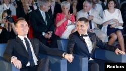 Vincent Aubin (L) and Bruno Boileau (R) react as they hold hands at their wedding ceremony at the city hall in Montpellier, May 29, 2013.