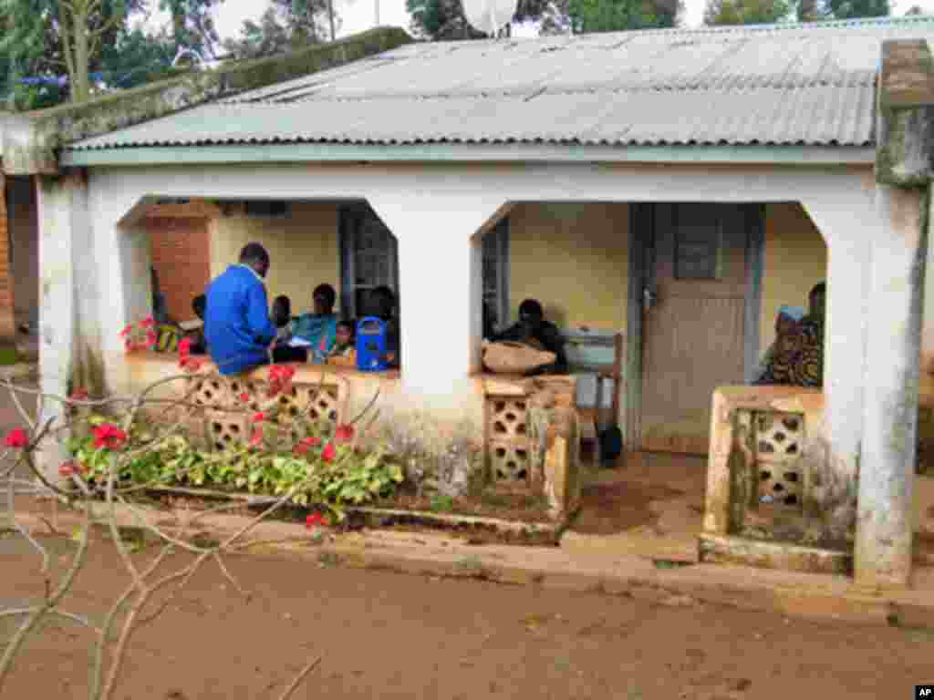 Friends in Malawi gather to listen to a segment of Reality Radio, a program with stories and interviews about girls' risks of HIV/AIDS. (Hilary Schwandt)