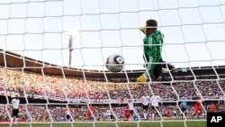 Germany's goalkeeper Manuel Neuer eyes the ball shot by England player Frank Lampard before goal was disallowed during 2010 World Cup round of 16 soccer match, 27 Jun 2010