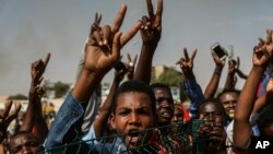 FILE - Sudanese protesters rally in the capital Khartoum, Apr. 26, 2019. Ultraconservative preacher Abdel-Hay Youssef is cancelling a planned rally for fear of violence from the protesters who drove al-Bashir from power earlier this month.