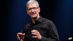 FILE - Apple CEO Tim Cook speaks during an Apple event in San Francisco, Sept. 12, 2012.
