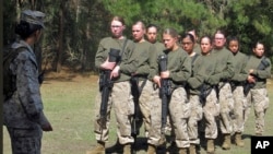 FILE - Female recruits stand at the Marine Corps Training Depot on Parris Island, South Carolina, Feb. 21, 2013.