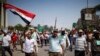 Supporters of deposed Egyptian President Mohamed Mursi march from Raba El-Adwyia square to the Republican Guards headquarters where they believe he is being held by the army in Cairo, July 7, 2013. 