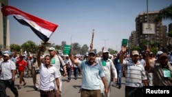 Supporters of deposed Egyptian President Mohamed Morsi march in Cairo July 7, 2013, calling for him to be restored a president. 